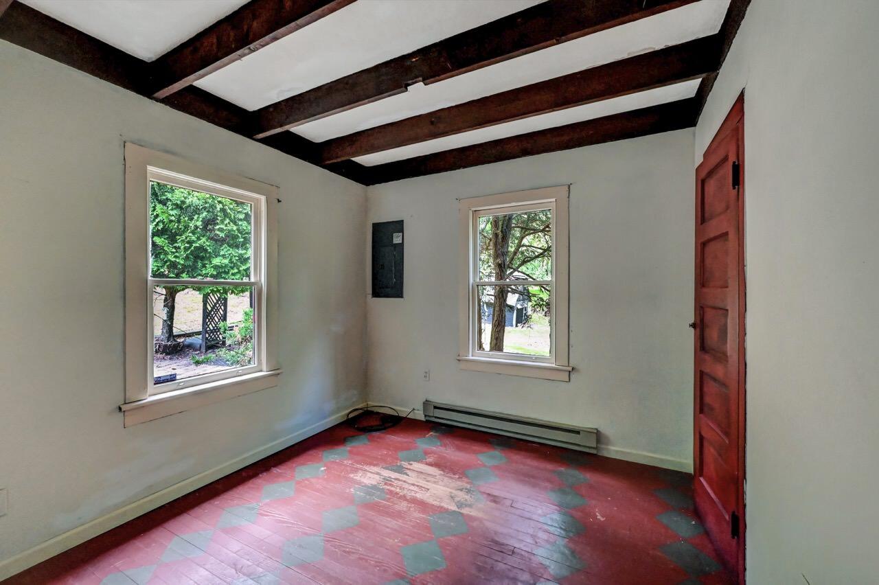 2285 Bear Town Road Canadensis, PA 18325 - Photo 36 of 58 an empty room with wooden floor and windows