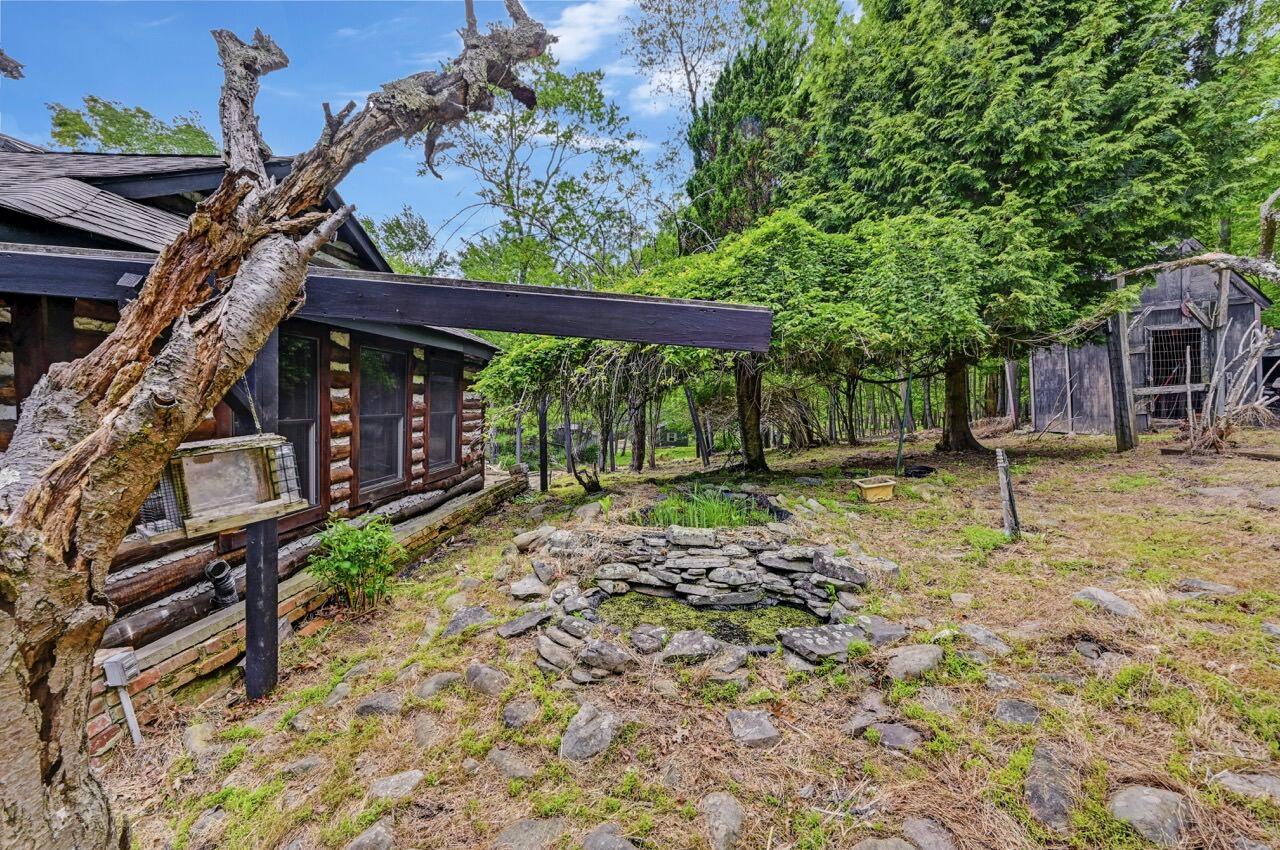 2285 Bear Town Road Canadensis, PA 18325 - Photo 56 of 58 a view of a house with backyard and sitting area
