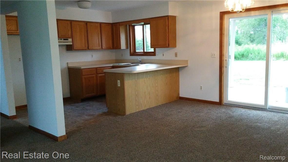 3930 West Maple Road Wixom, MI 48393 - Photo 17 of 23 Lower Dining/ Kitchen