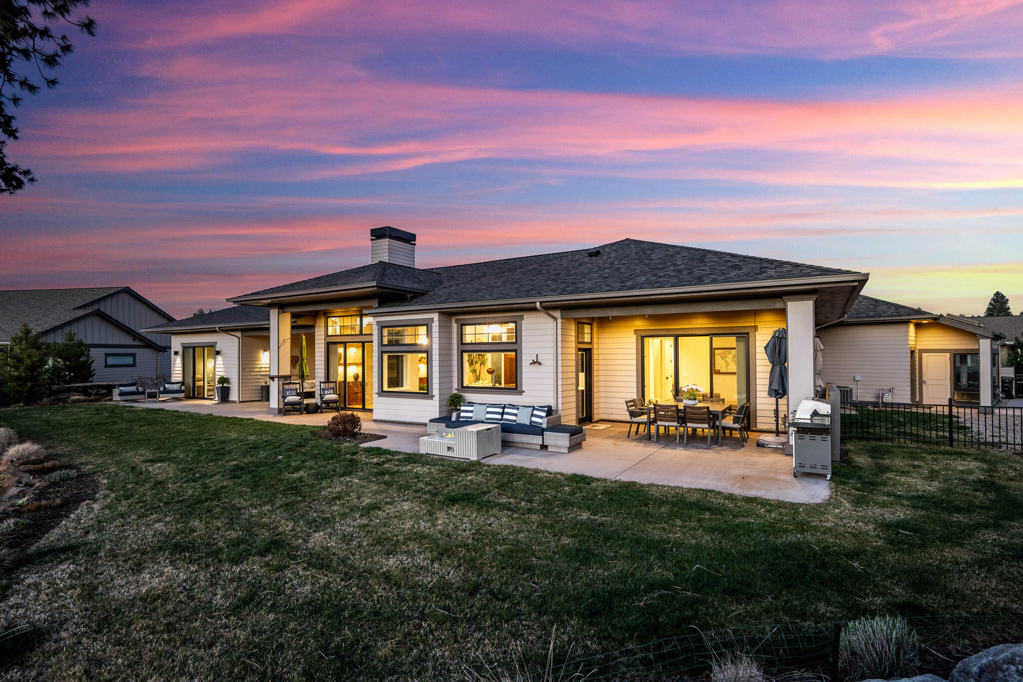 60871 River Rim Drive Bend, OR 97702 - Photo 6 of 42 a front view of a house with a yard