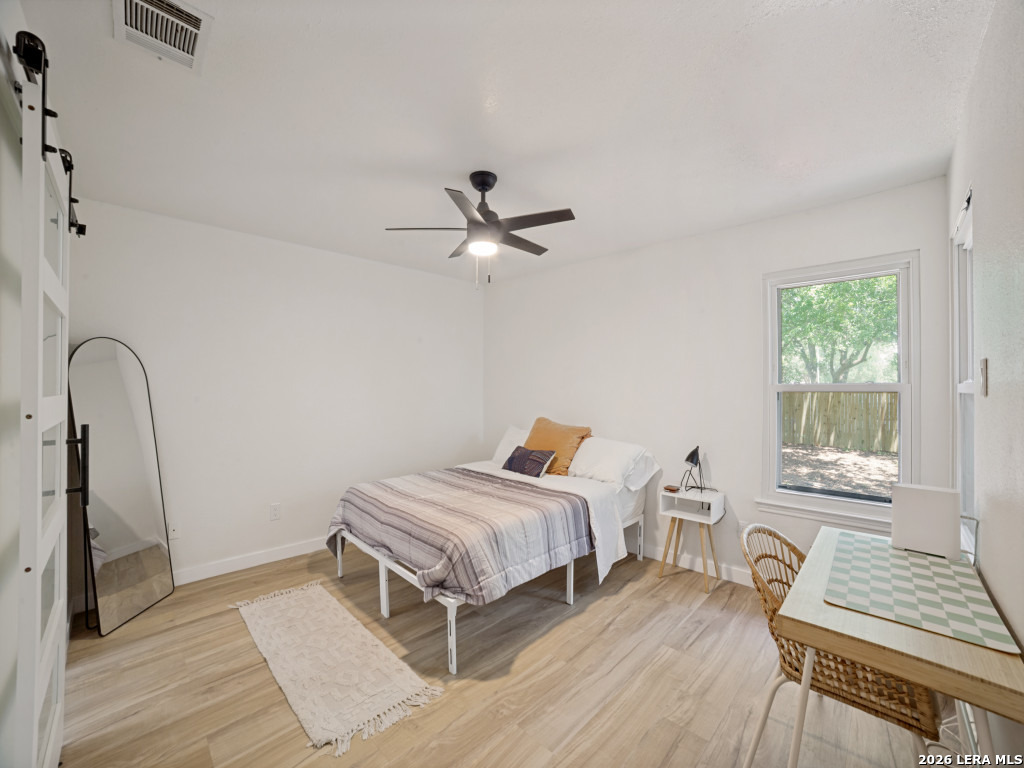 3439 Ridge Ranch San Antonio, TX 78247 - Photo 13 of 25 a bedroom with a bed and a window