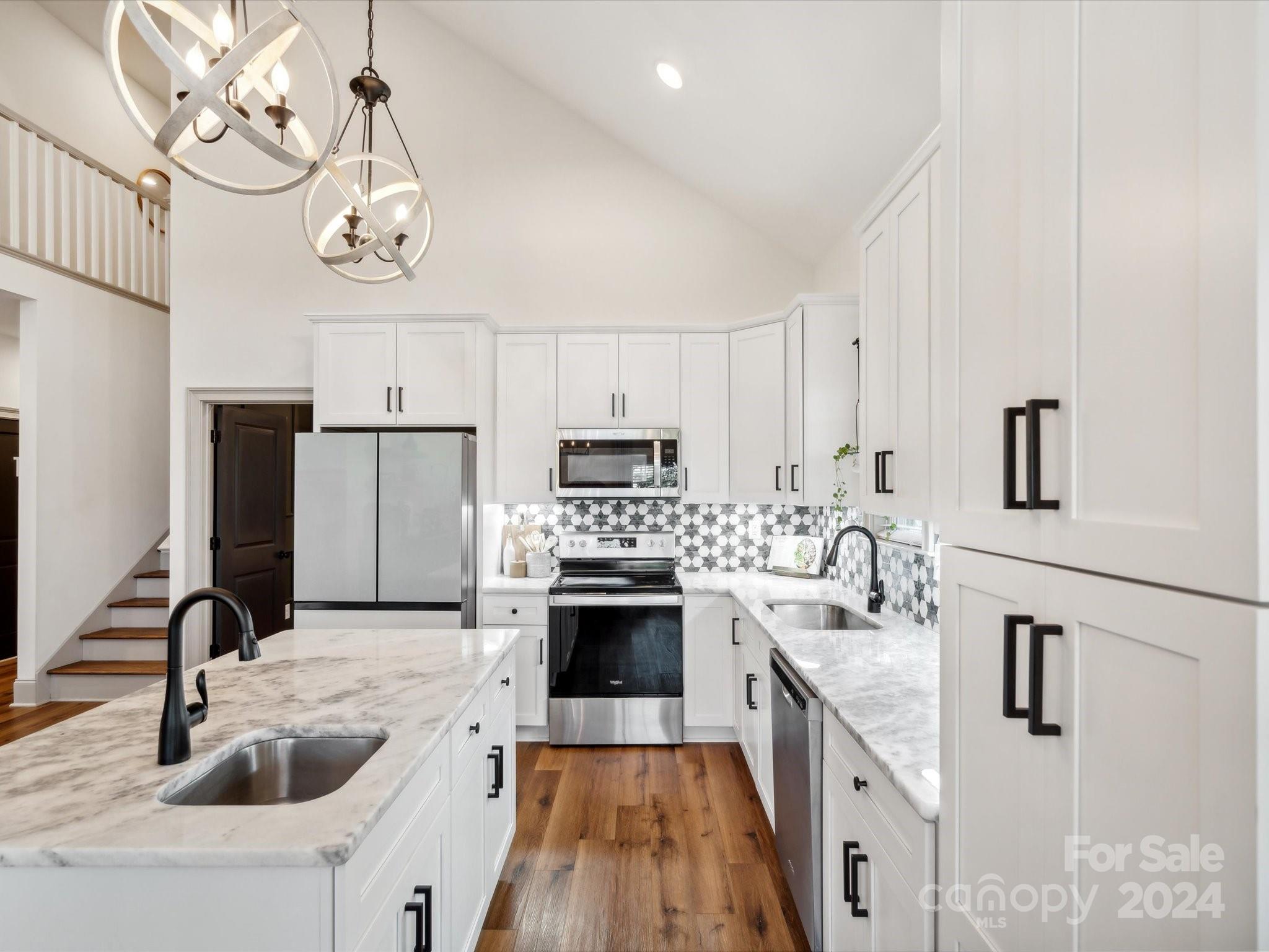 246 East Rambo Road Rock Hill, SC 29730 - Photo 14 of 48 a kitchen with kitchen island a sink appliances and cabinets
