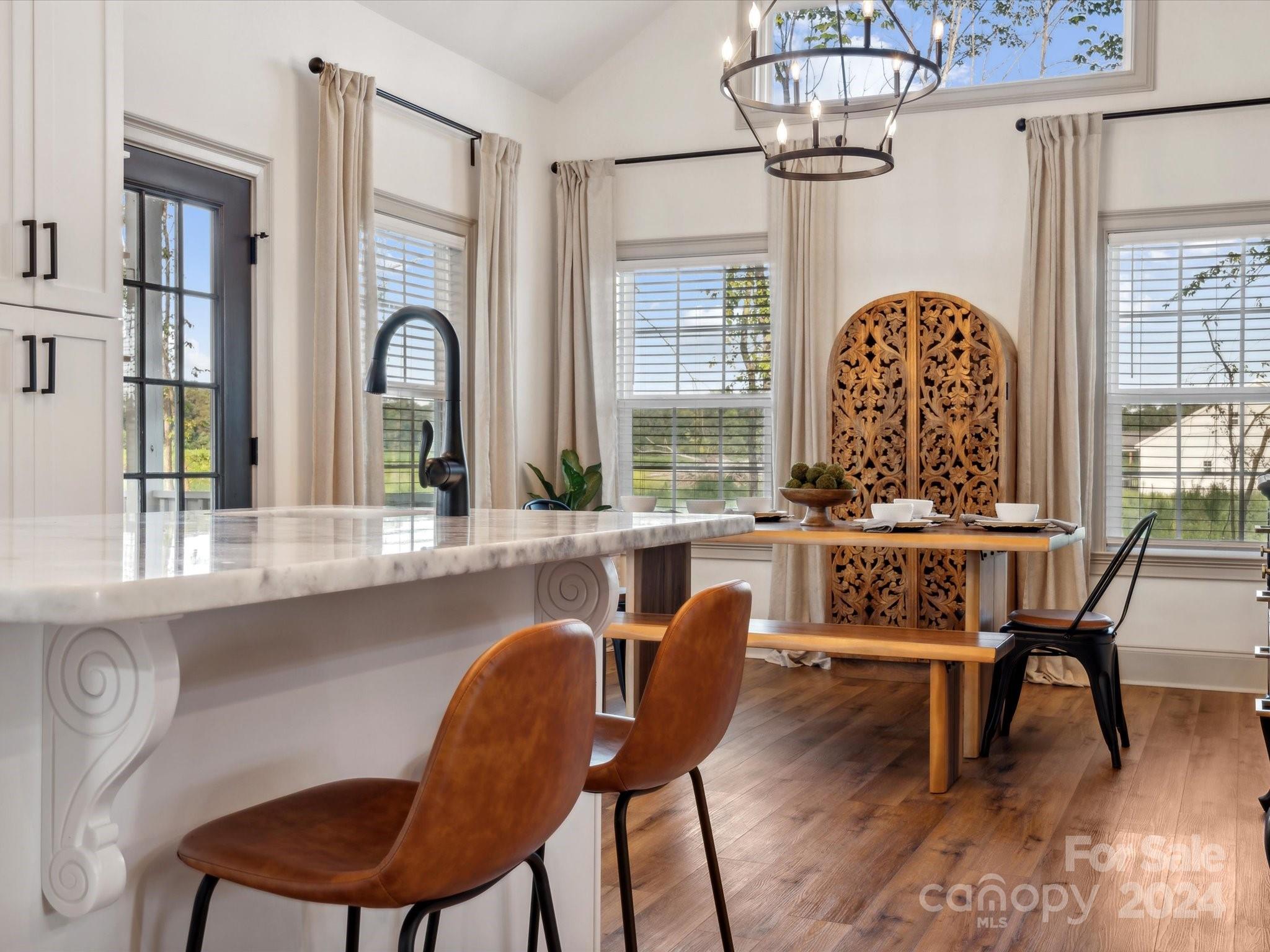 246 East Rambo Road Rock Hill, SC 29730 - Photo 16 of 48 a dining room with furniture a chandelier and wooden floor
