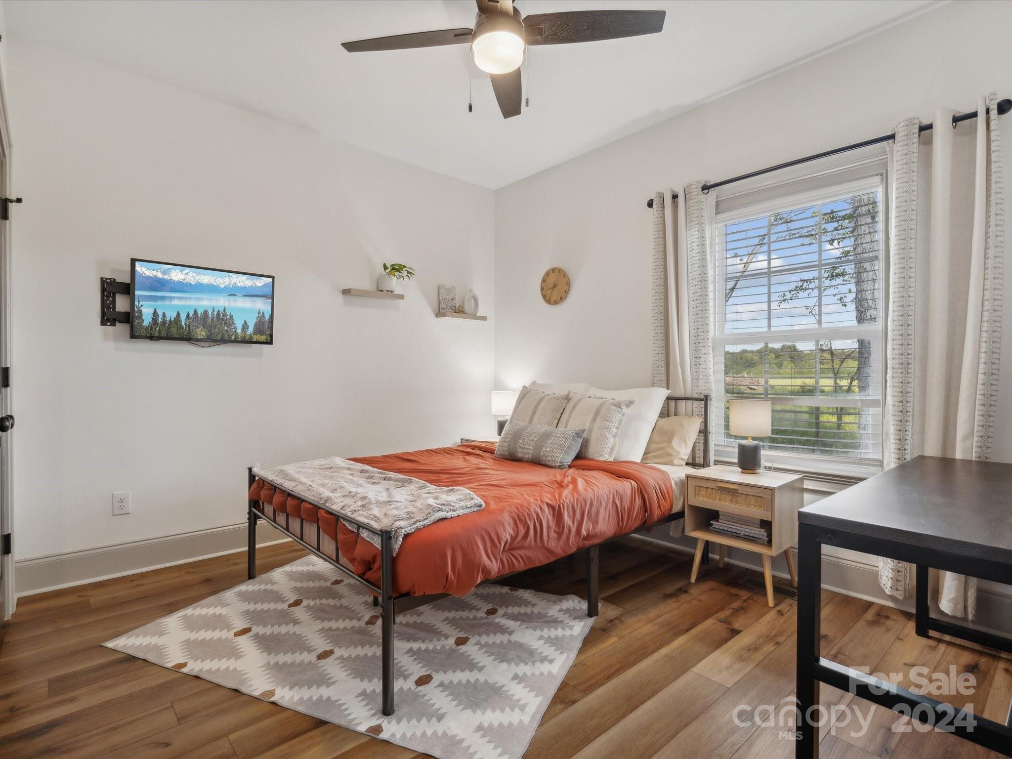 246 East Rambo Road Rock Hill, SC 29730 - Photo 25 of 48 a bedroom with a bed a table and a window