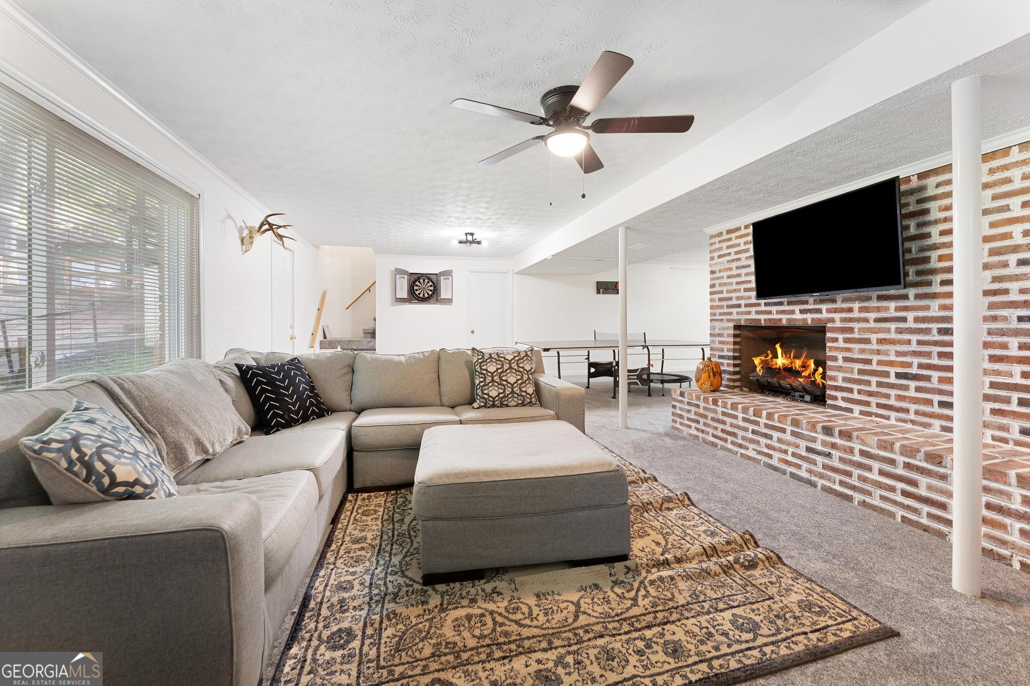 318 Chandler Street Hartwell, GA 30643 - Photo 17 of 29 a living room with furniture and a flat screen tv