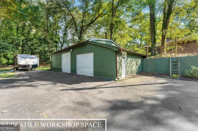 a yellow house with trees in front of it