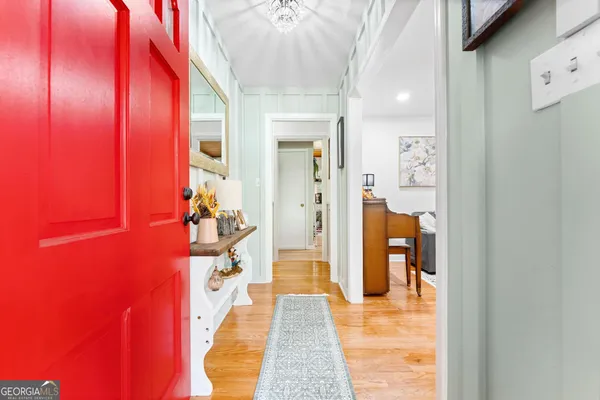 a kitchen with stainless steel appliances granite countertop a sink and a refrigerator
