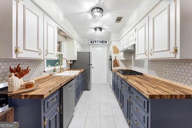 a dining room with furniture a fireplace and wooden floor