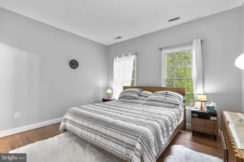 a bedroom with a bed and a closet