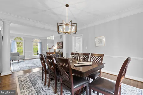 a kitchen with kitchen island granite countertop wooden floors and stainless steel appliances