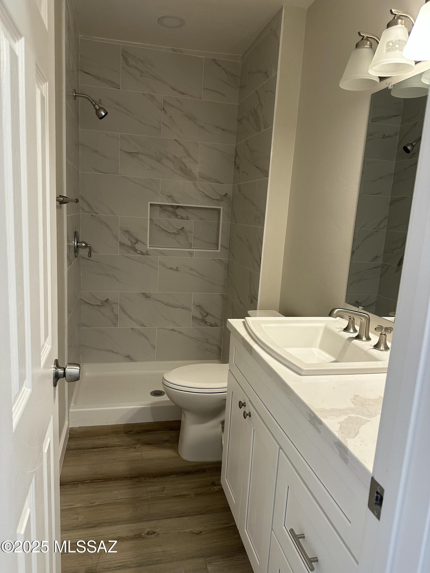 645 East Mabel Street Tucson, AZ 85705 - Photo 21 of 22 a bathroom with a sink toilet and shower
