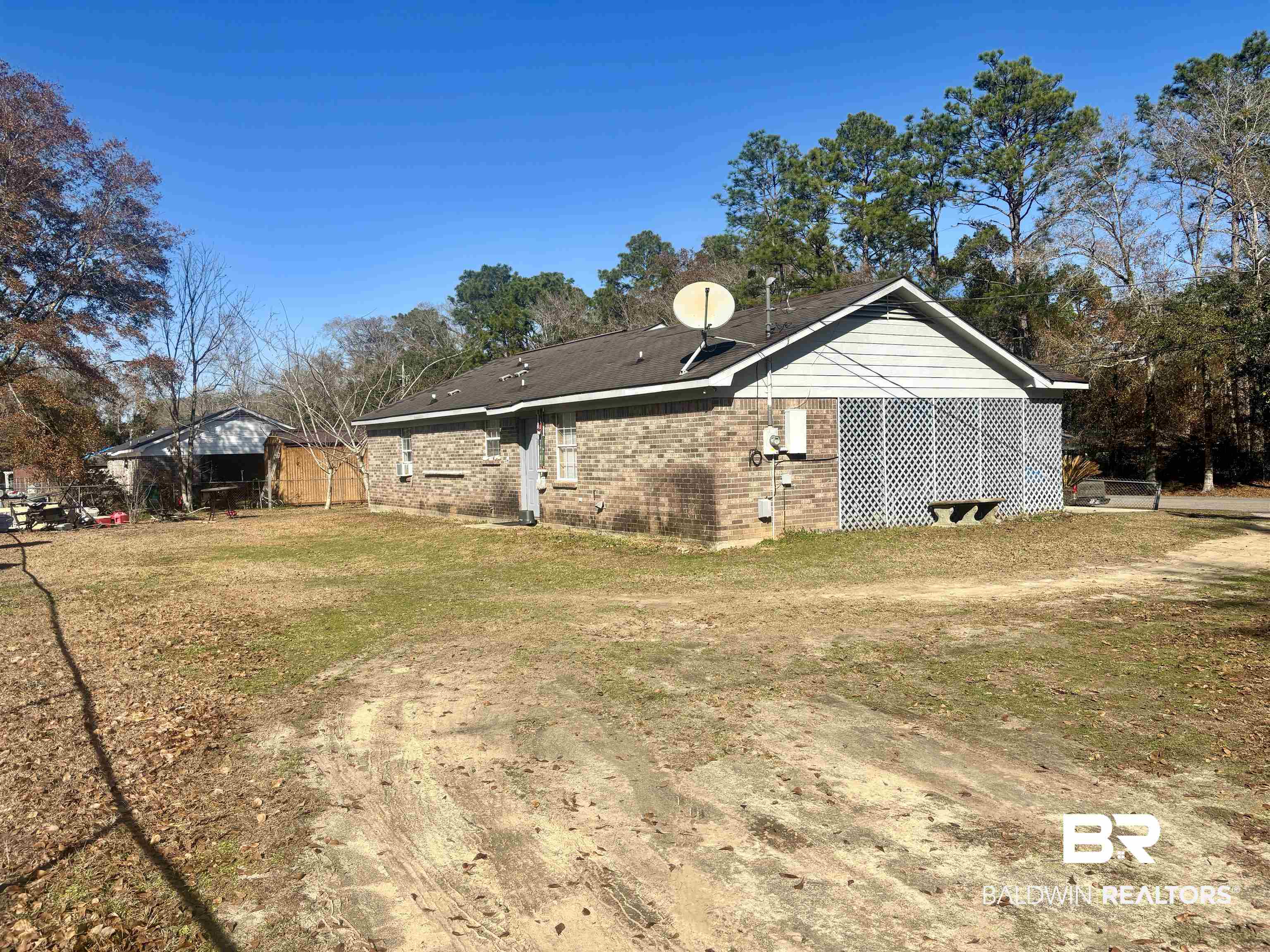 320 South Pecan Street Foley, AL 36535 - Photo 16 of 17 View of side of property with a lawn