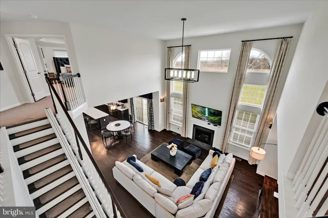 a en suite bathroom with a toilet a sink and a mirror