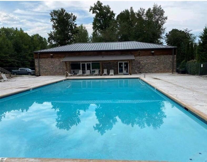 227 Peaceful Loop Chatsworth, GA 30705 - Photo 14 of 16 a view of a house with pool yard