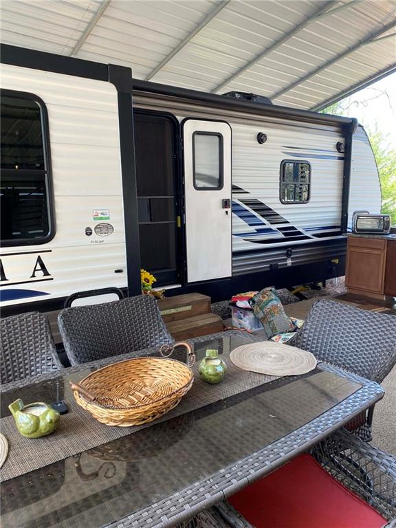 227 Peaceful Loop Chatsworth, GA 30705 - Photo 2 of 16 a living room with furniture and flat screen tv
