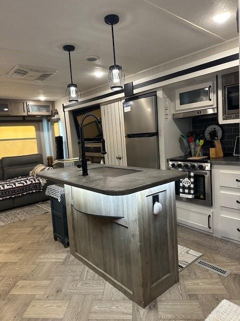 227 Peaceful Loop Chatsworth, GA 30705 - Photo 7 of 16 a kitchen with lots of counter top space