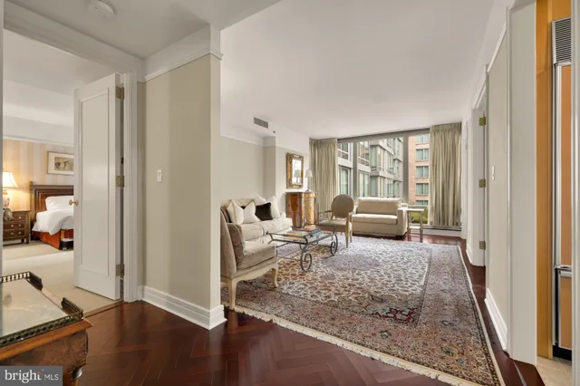 a living room with furniture window and a table