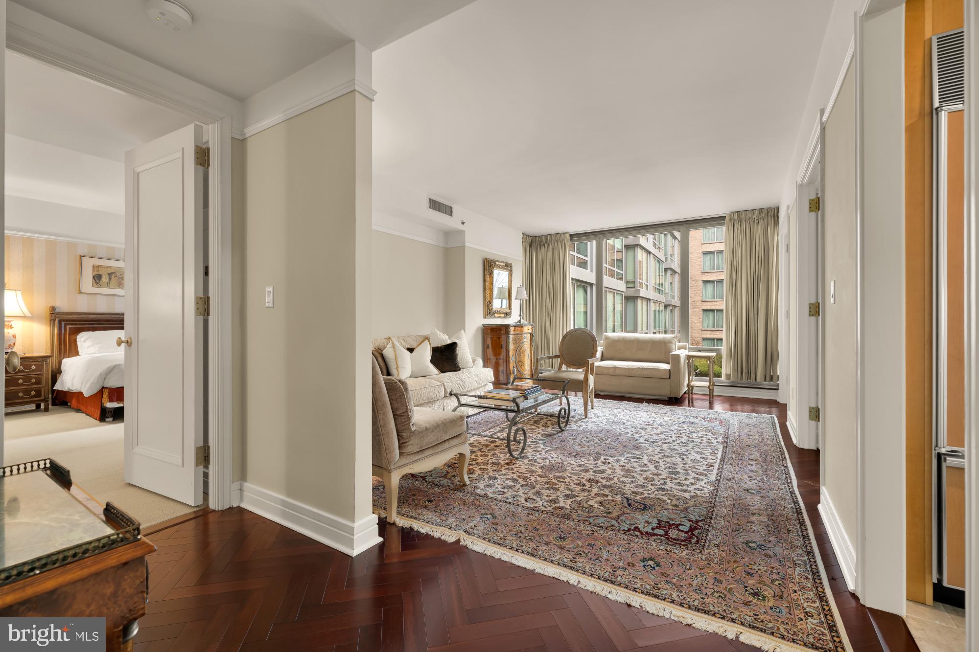 1155 23rd Street Northwest, Unit 6H Washington, DC 20037 - Photo 14 of 27 a living room with furniture window and a table