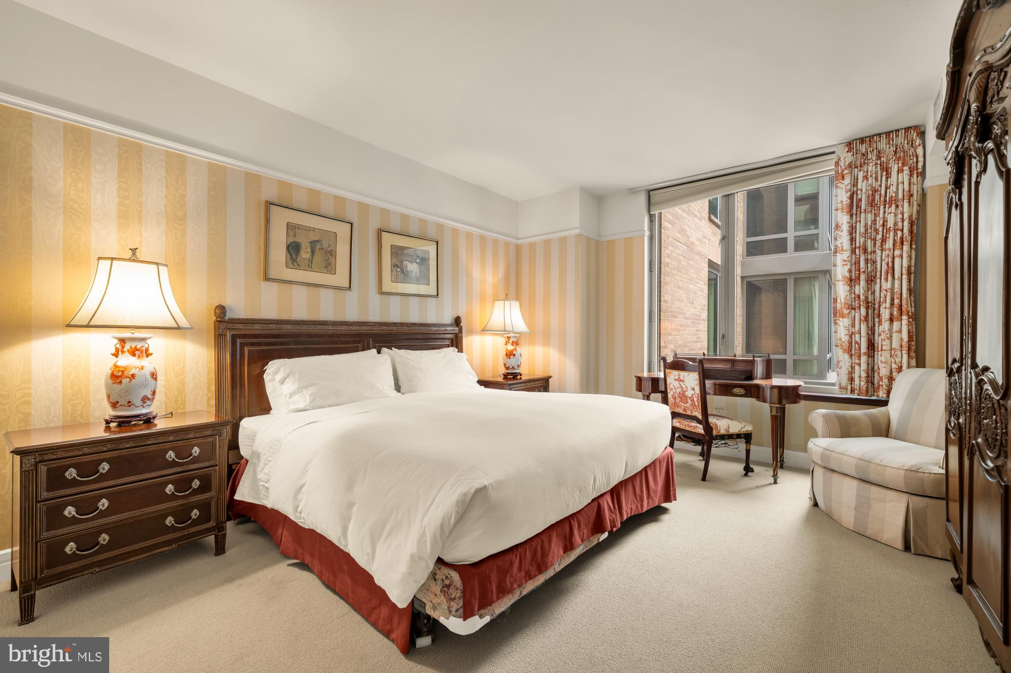 1155 23rd Street Northwest, Unit 6H Washington, DC 20037 - Photo 17 of 27 a bedroom with a bed and a couch