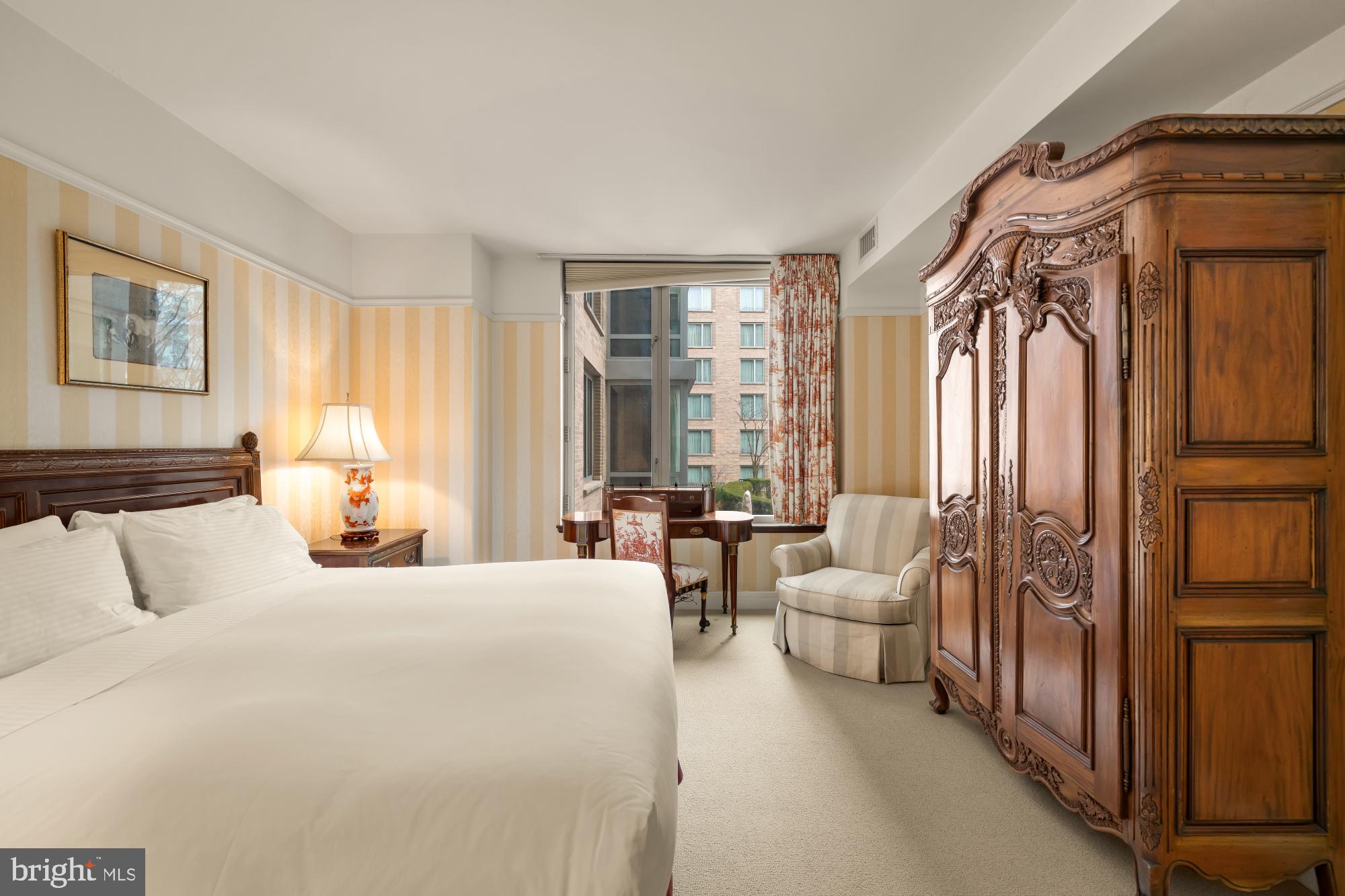 1155 23rd Street Northwest, Unit 6H Washington, DC 20037 - Photo 18 of 27 a bedroom with furniture and a large window