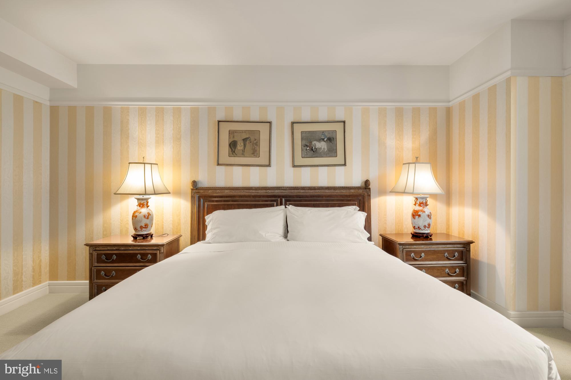 1155 23rd Street Northwest, Unit 6H Washington, DC 20037 - Photo 19 of 27 a bedroom with a bed and a lamp