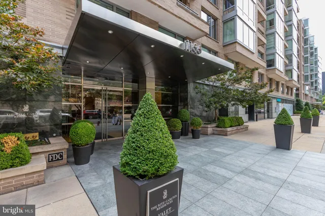 a front view of a building with garden