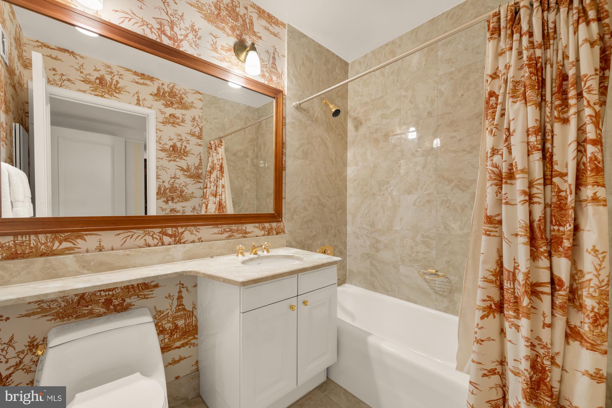 1155 23rd Street Northwest, Unit 6H Washington, DC 20037 - Photo 21 of 27 a bathroom with a sink and a mirror