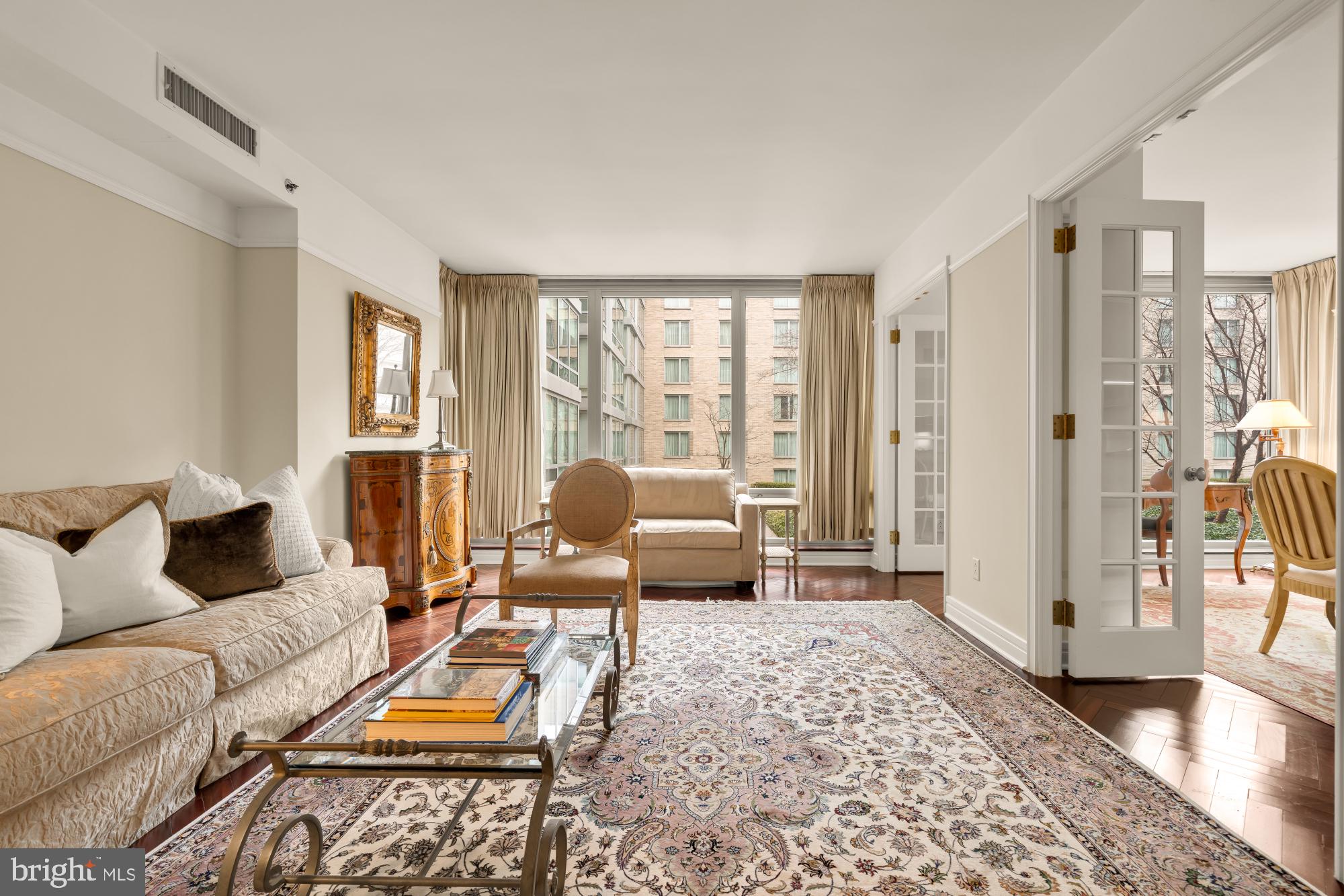 1155 23rd Street Northwest, Unit 6H Washington, DC 20037 - Photo 5 of 27 a living room with furniture and a window