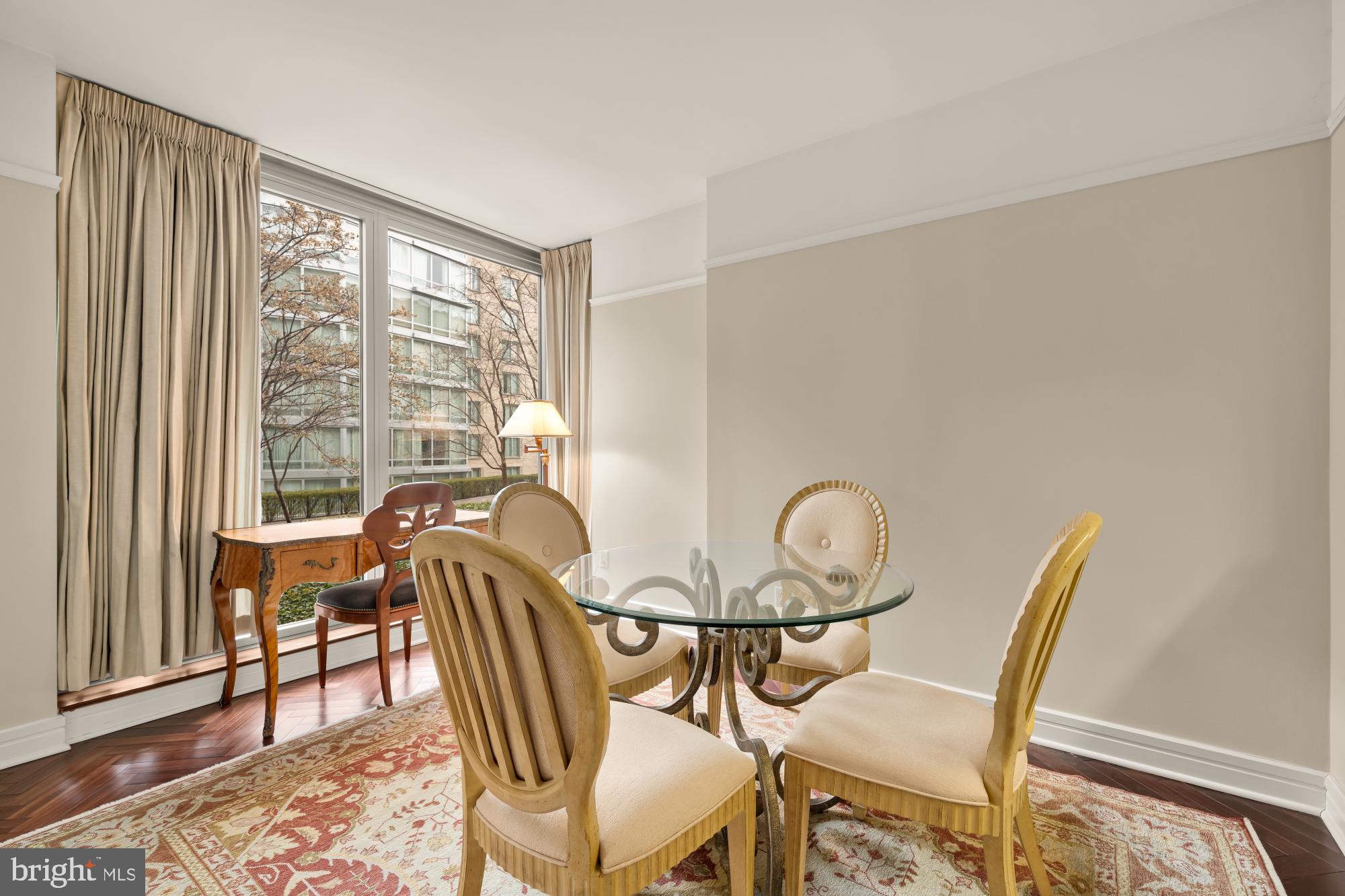 1155 23rd Street Northwest, Unit 6H Washington, DC 20037 - Photo 9 of 27 a view of a dining room with furniture and wooden floor