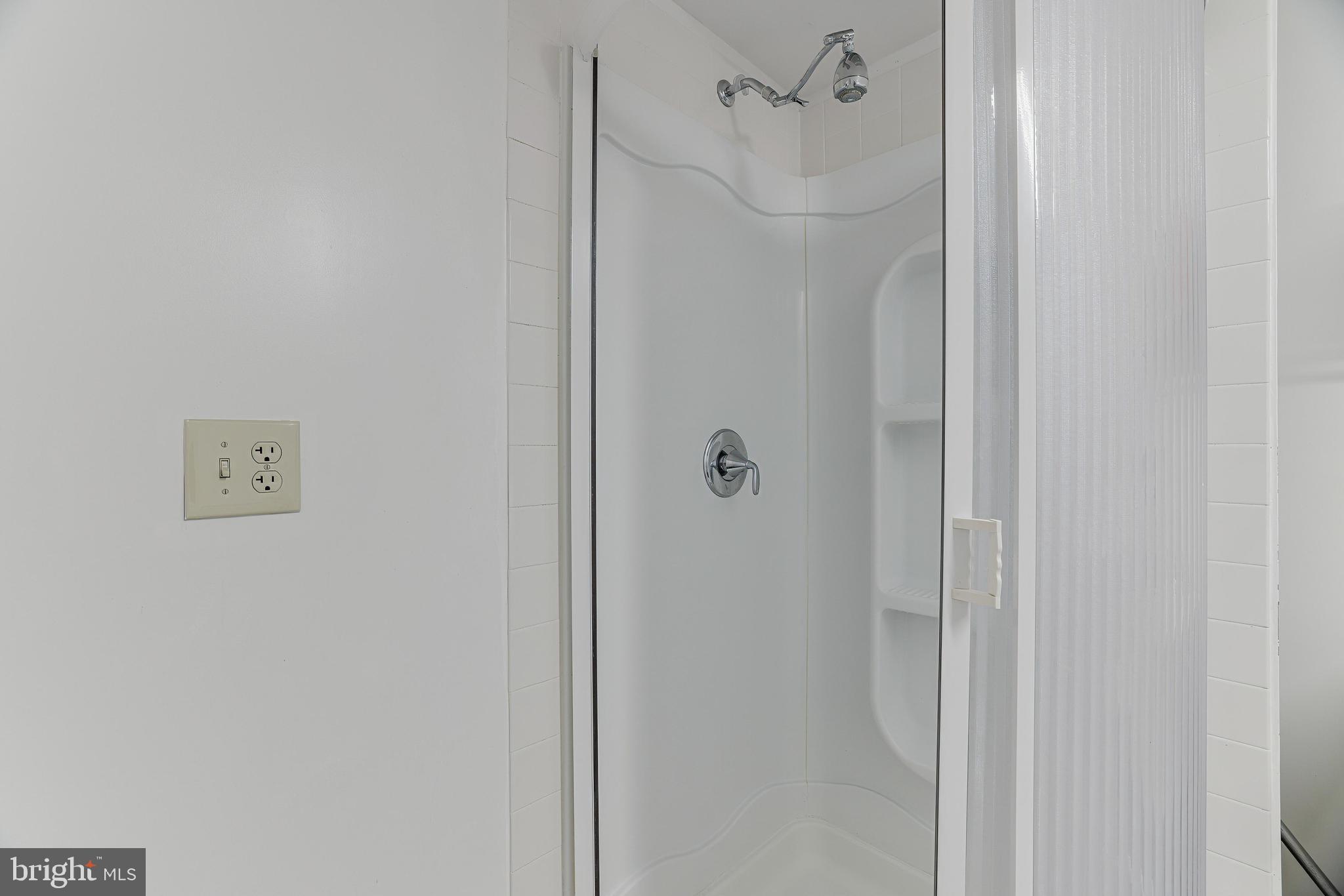 8813 Winding Hollow Way Springfield, VA 22152 - Photo 20 of 29 a bathroom with a shower