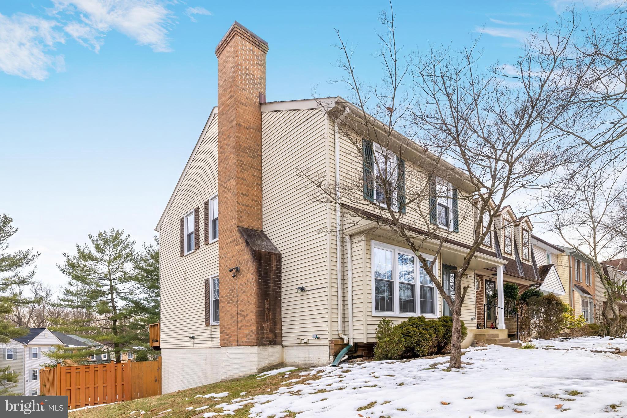 8813 Winding Hollow Way Springfield, VA 22152 - Photo 2 of 29 a view of a white house with a yard