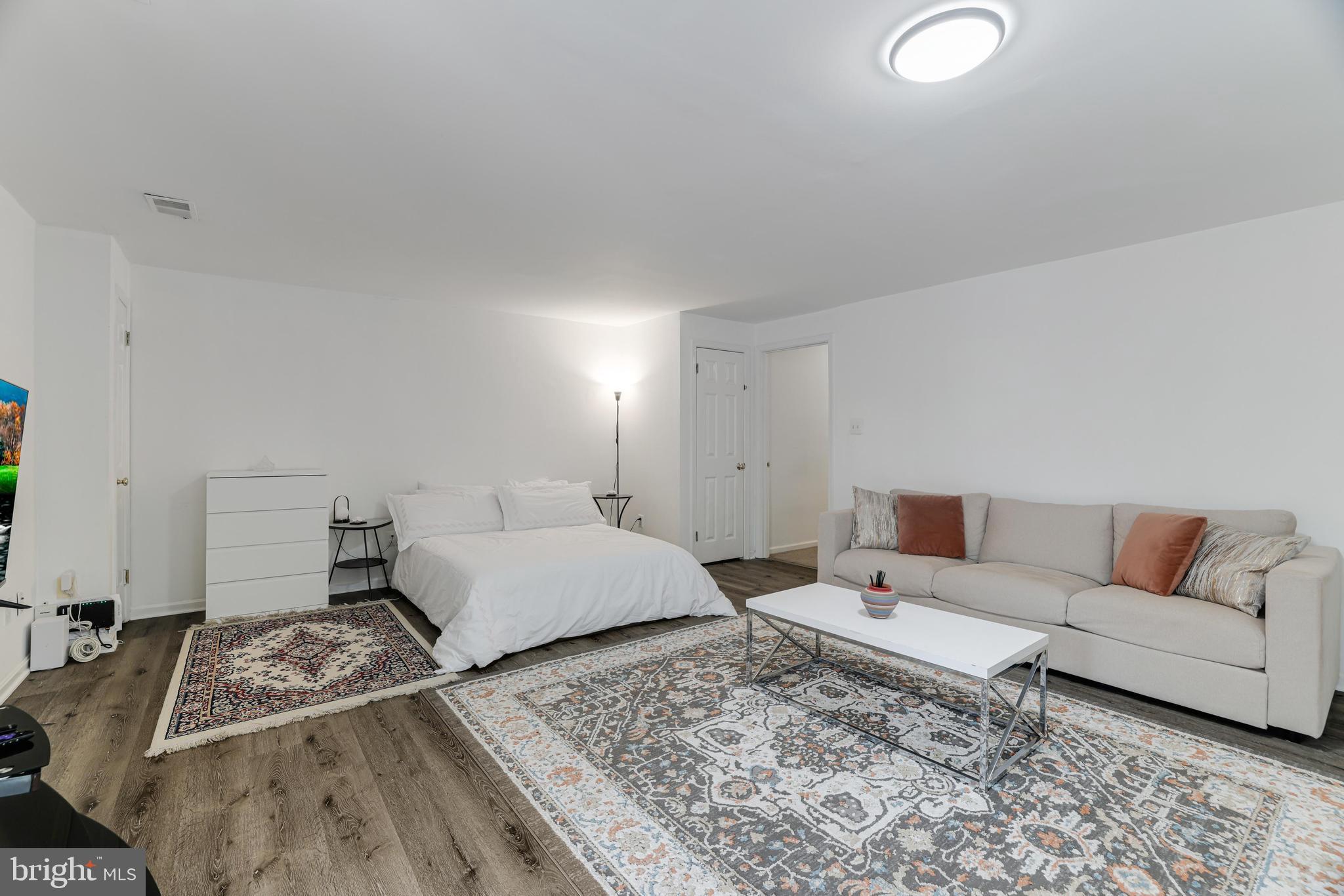 8813 Winding Hollow Way Springfield, VA 22152 - Photo 22 of 29 a living room with furniture and a couch