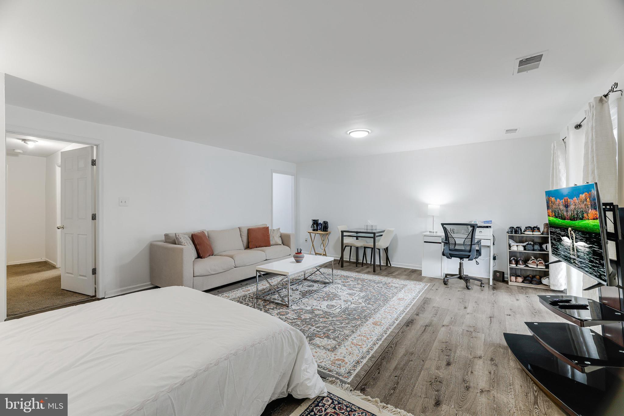 8813 Winding Hollow Way Springfield, VA 22152 - Photo 23 of 29 a living room with furniture and a wooden floor