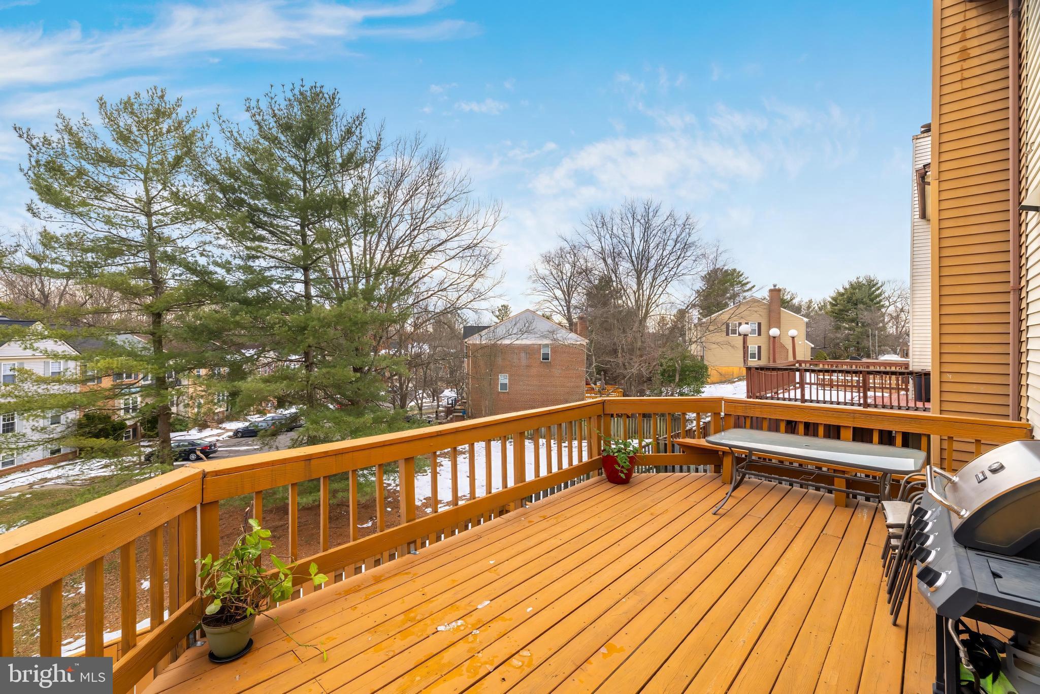 8813 Winding Hollow Way Springfield, VA 22152 - Photo 26 of 29 a view of a balcony with wooden floor and fence