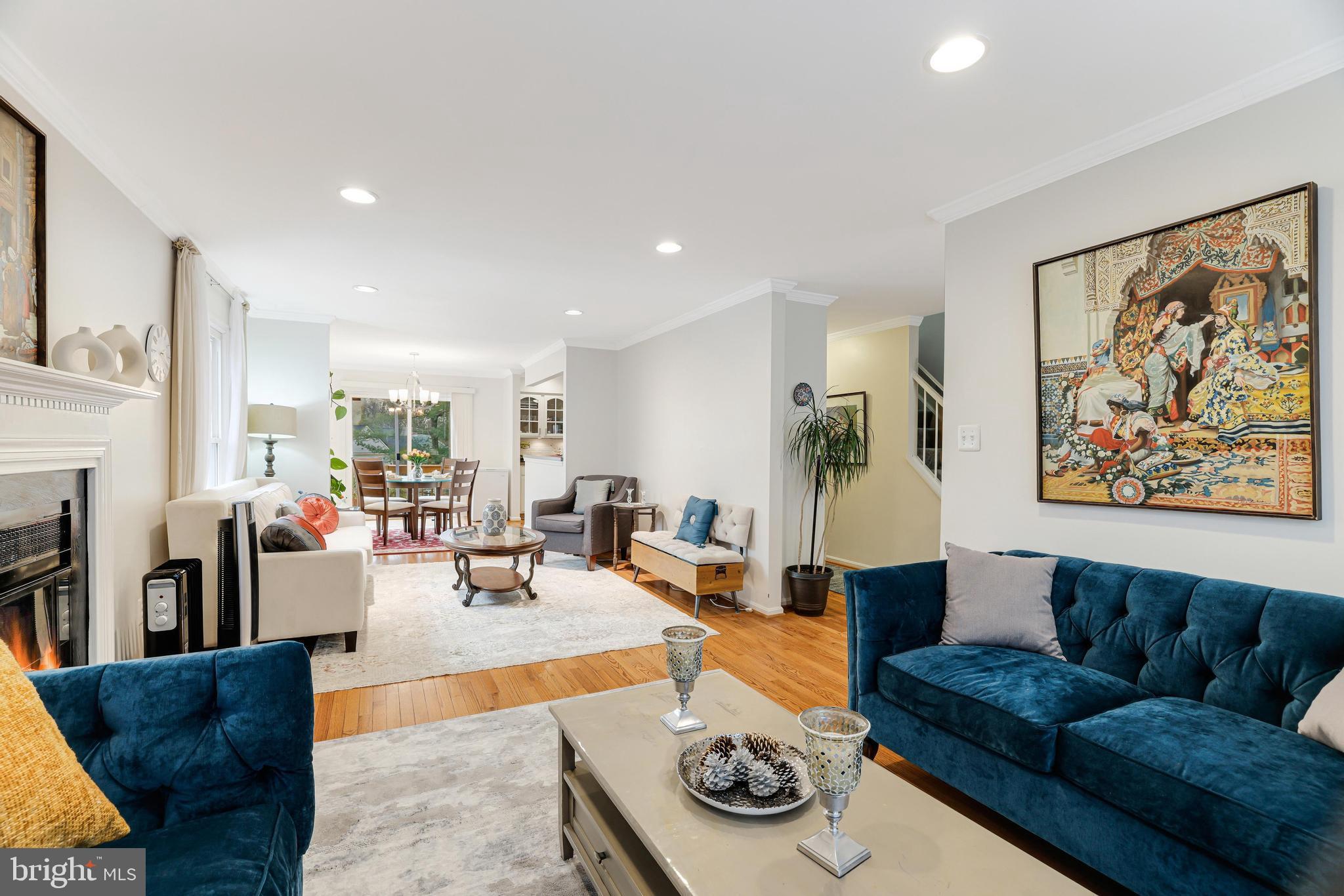 8813 Winding Hollow Way Springfield, VA 22152 - Photo 7 of 29 a living room with furniture and a fireplace