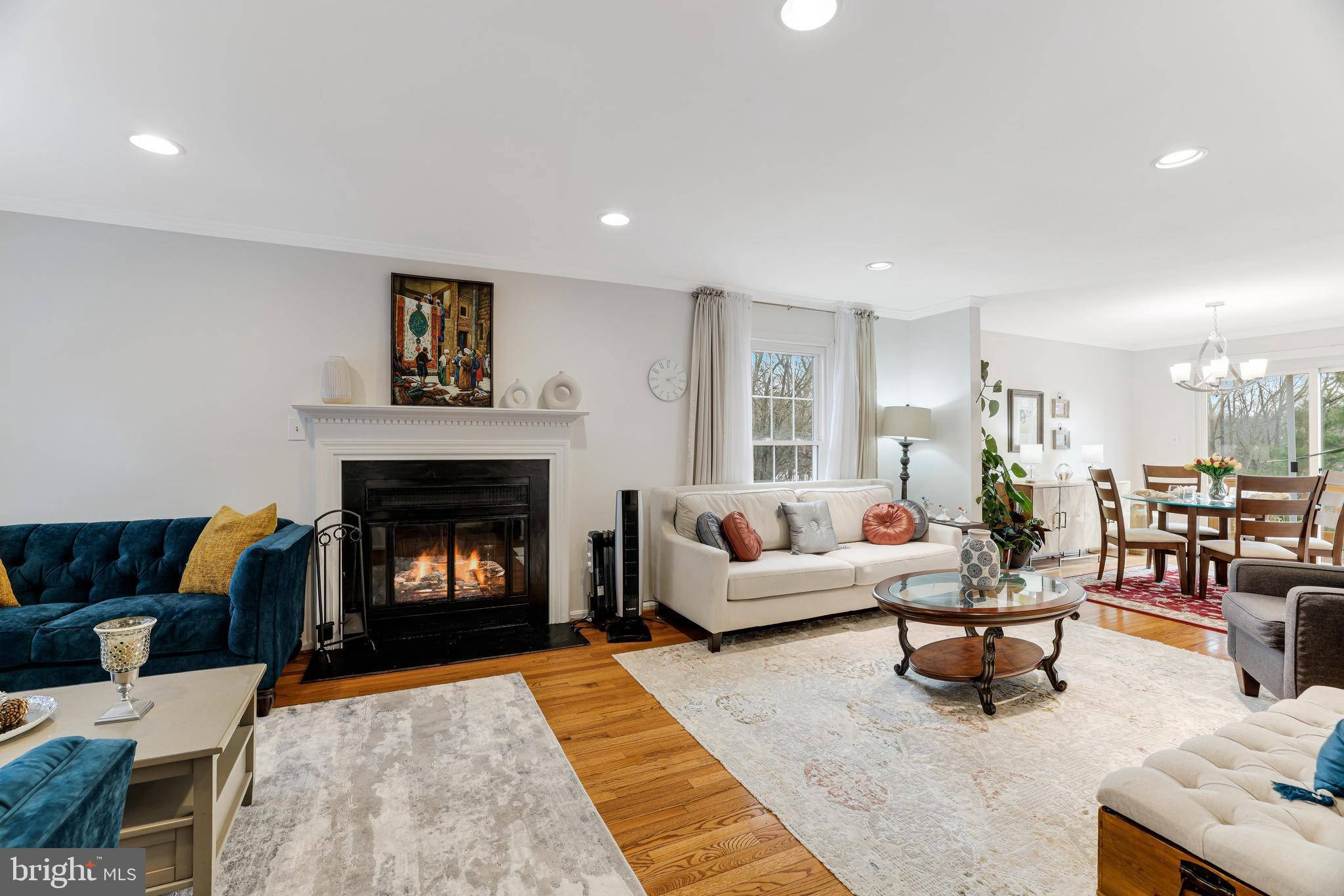 8813 Winding Hollow Way Springfield, VA 22152 - Photo 9 of 29 a living room with furniture and a fireplace