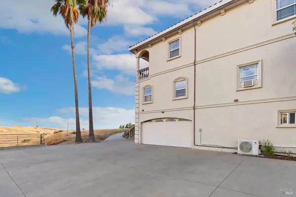 a view of a balcony with a table and chairs