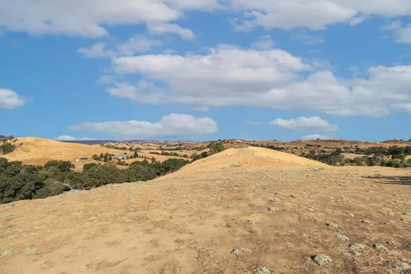 a view of workspace with furniture and window