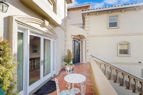 a view of a balcony with an outdoor space and seating