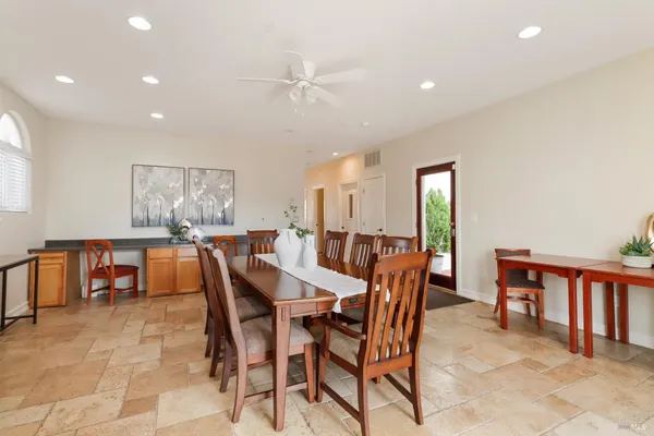 a bedroom with a bed and a chair