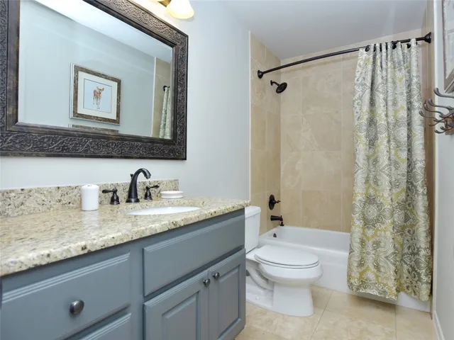 a bedroom with two beds and a large window