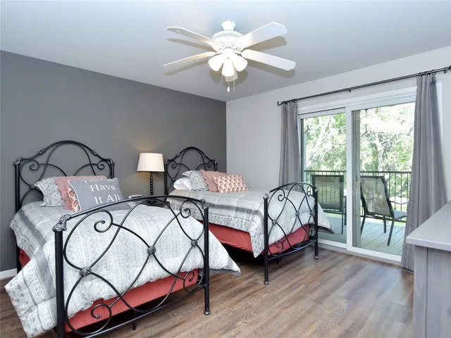 a bedroom with bed and a desk