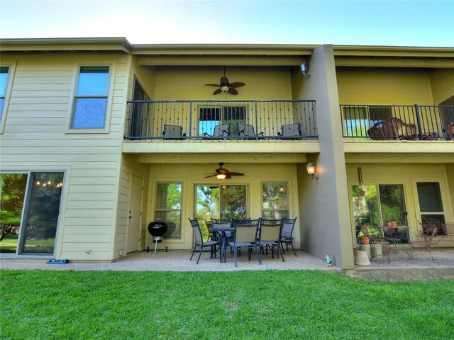 a view of a swimming pool with an outdoor space and seating area