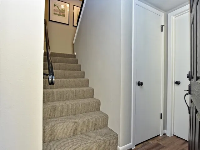 a view of staircase with white walls
