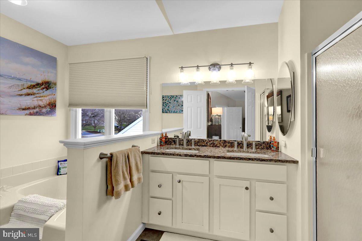 1102 Pepper Ridge Drive Reading, PA 19606 - Photo 18 of 33 a bathroom with a double vanity sink and a mirror