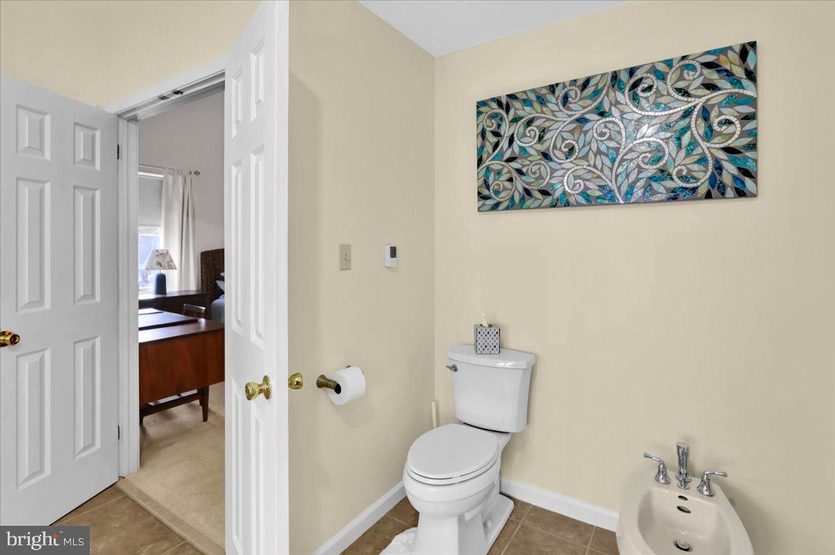 1102 Pepper Ridge Drive Reading, PA 19606 - Photo 20 of 33 a bathroom with a toilet and a shower curtain
