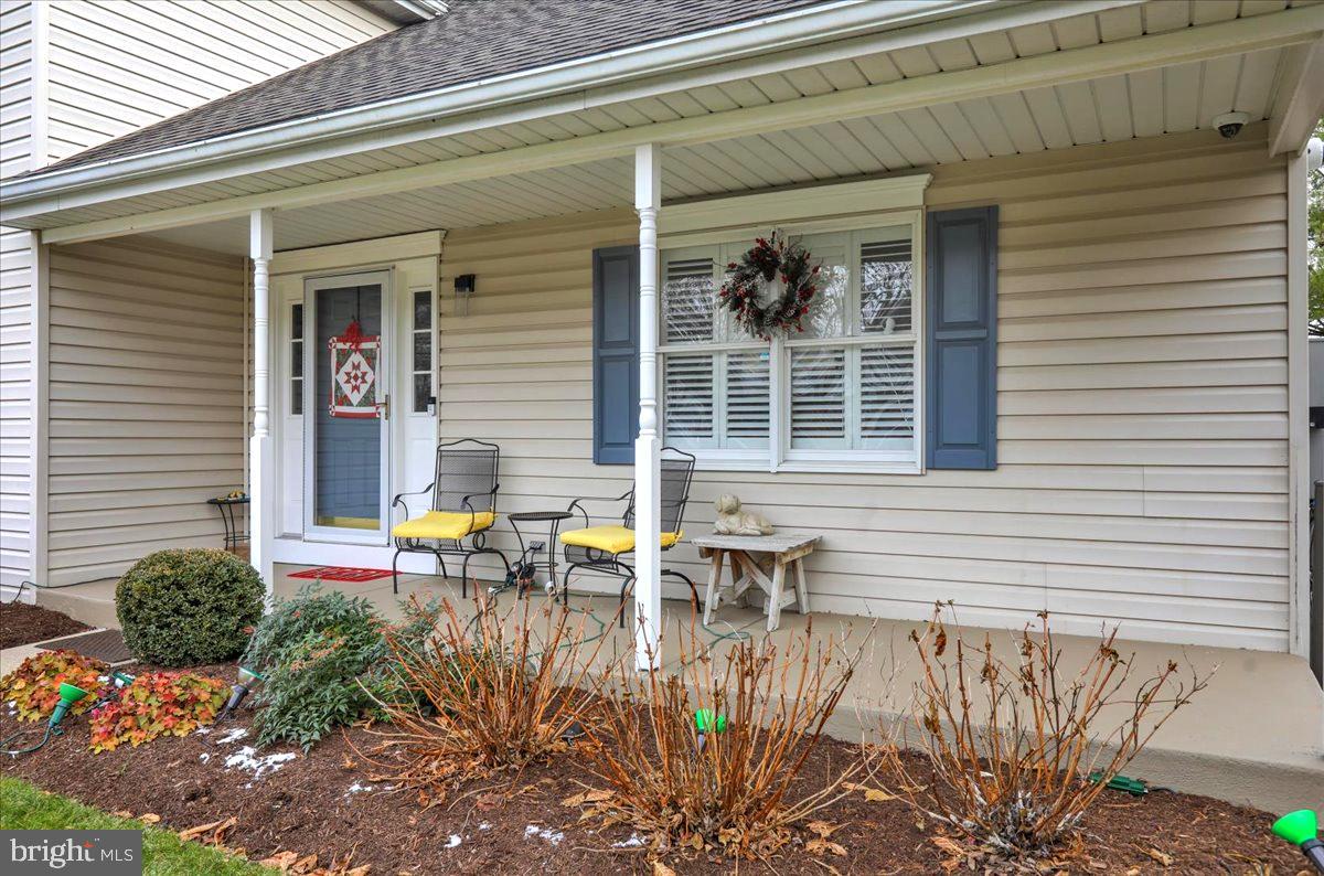 1102 Pepper Ridge Drive Reading, PA 19606 - Photo 2 of 33 a view of a patio with table and chairs and potted plants