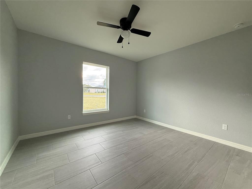 2460 Northwest Buena Vista Road Dunnellon, FL 34431 - Photo 4 of 14 a view of an empty room with a window