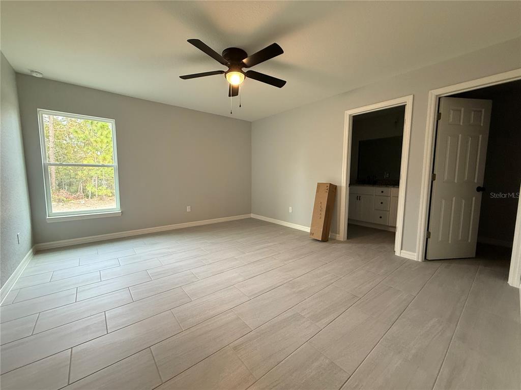 2460 Northwest Buena Vista Road Dunnellon, FL 34431 - Photo 10 of 14 an empty room with windows and closet