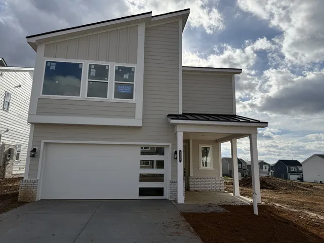 a front view of a house with garage